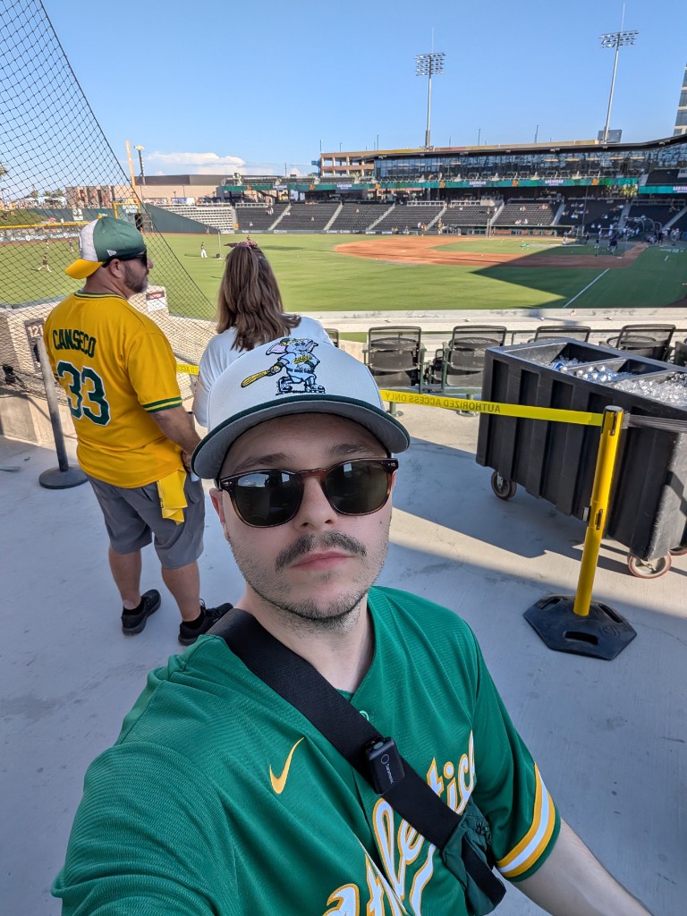 Jacob at an Athletics game in Las Vegas wearing team gear